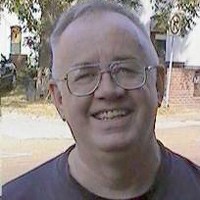 Kenzie Walker Older man with glasses and thinning gray hair
